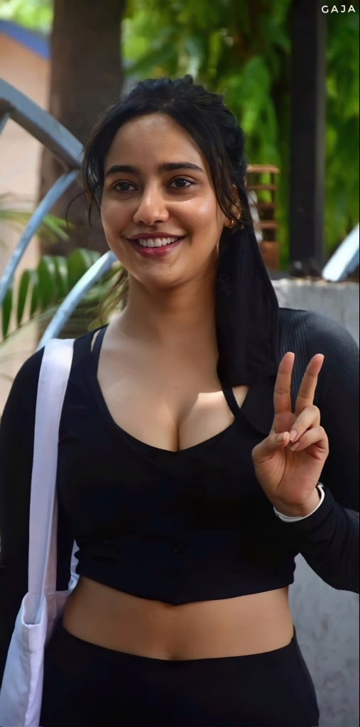 Neha Sharma low neck cleavage outdoor photos